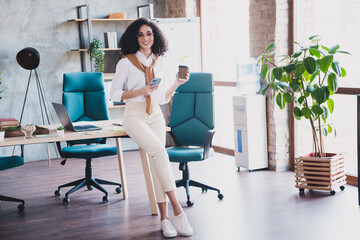 Poster - Portrait of elegant corporate worker lady hold phone coffee wear white shirt business center indoors