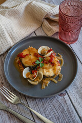 fish dish with clams and homemade sauce 