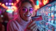 © Nova Widiawati - Woman Holding Credit Card in Neon Lights