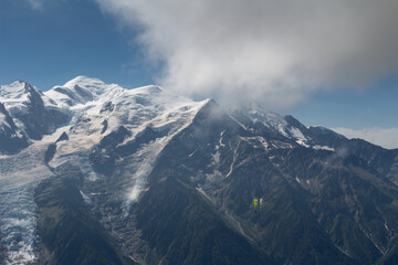 Wall Mural - Panorama of alps. Extreme sports in mountains. High resolution photo. Ski, parasailing, climbing, alpinism.