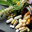 © Pornarun - A close-up of herbal supplements and vitamins spilled from a bottle, alongside fresh herbs in the background, symbolizing natural health and wellness.