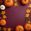 © Olga - Pumpkin and autumn leaves still life square frame with copy space at the center. Top view festive fall flat lay at dark maroon background. Thanksgiving, harvest day or Halloween celebration concept.