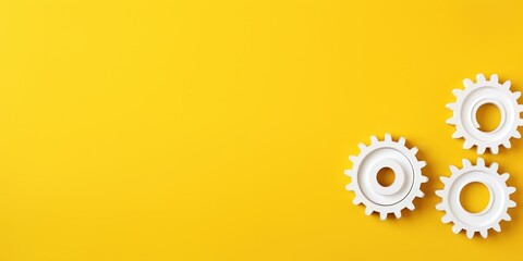 Wall Mural - Three white gears on a Yellow background, laid flat, copy space concept for business technology and development in the abstract vector with copy space 