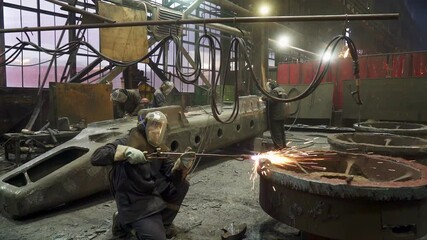 Wall Mural - An Industrial Workshop Featuring Workers Operating in a Heavy Machinery Environment. Stock Clip