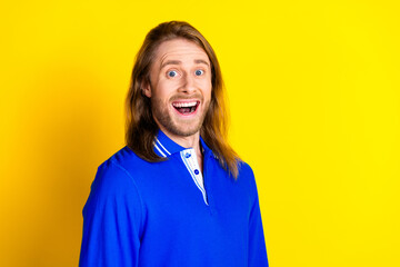 Poster - Photo of attractive cheerful nice man wear blue stylish pullover isolated on yellow color background