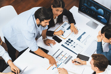 Poster - Project manager communicate and collaborate with team using project management software display on monitor, tracking progress of project task and making schedule plan at meeting table. Prudent