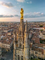  The drone aerial view of Pey Berland Tower at sunrise, Bordeaux, France. Pey Berland Tower named for its patron Pey Berland, is the separate bell tower of the Bordeaux Cathedral.