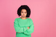 © deagreez - Portrait photo of young charming woman with chevelure in green stylish sweatshirt upset folded hands isolated on pink color background
