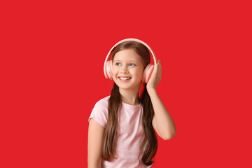 Poster - Little girl in headphones on red background