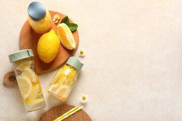 Wall Mural - Bottles of infused water with lemon on light background