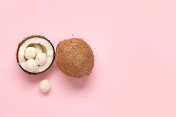 Canvas Print - Coconut with white chocolate candies on pink background