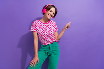 Sticker - Photo of cheerful positive glad girl wear pink stylish clothes presenting empty space mockup novelty isolated on purple color background