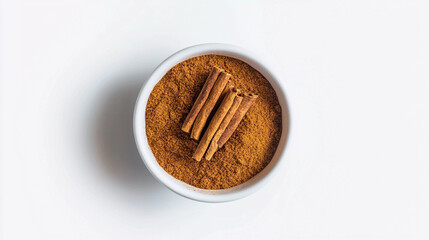 Canvas Print - Top view of cinnamon powder in bowl isolated on white background