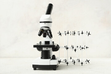 Wall Mural - Microscope and molecule on light background