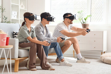 Canvas Print - Father with his children in VR glasses playing video game on sofa at home