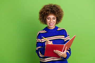 Canvas Print - Photo of pretty charming woman wear blue striped trendy clothes hold planner notes empty space isolated on green color background