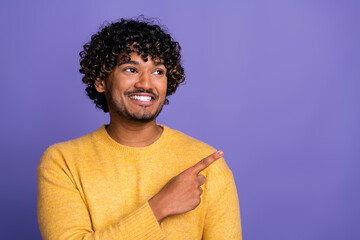 Sticker - Photo of funny glad man wear trendy yellow clothes demonstrate poster empty space isolated on violet color background