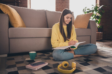 Sticker - Full length photo of nice teen lady sit floor do homework dressed yellow garment spend pastime spacious house indoors room