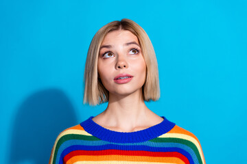 Poster - Portrait of pretty young girl look empty space wear striped pullover isolated on blue color background