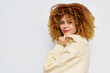 © SHOTPRIME STUDIO - Portrait of a young woman with curly hair in a cozy sweater against a light background, showcasing natural beauty and style, perfect for fashion, beauty, and lifestyle themes