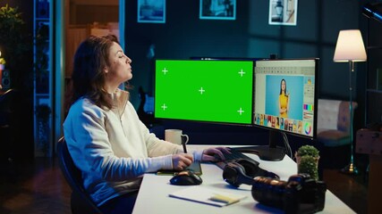 Poster - photo editor using green screen monitor to look at editorial pictures taken with professional camera