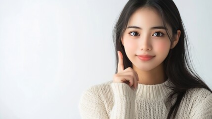 Aufkleber - Young Asian woman sitting and pointing to empty copy space isolated on white background Full body composition : Generative AI
