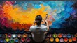 © Premium Resource - Stock photo of creative artist at work painting a vibrant mural on a large canvas surrounded by paints and brushes