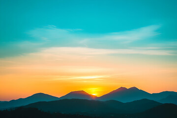 Wall Mural - Stunning mountain range silhouetted against a colorful sunset sky.