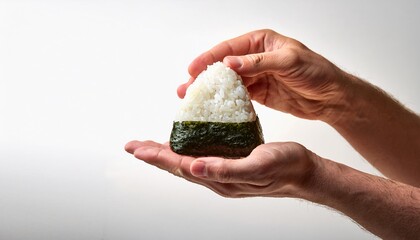 Wall Mural - White hands of man holding onigiri on white background isolated