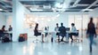 © adri - Blurred image of people working in a modern office.