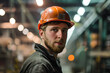 © Framefap - Worker in Hard Hat Dealing with Glare from Unpolished Overhead Lights in Brightly Lit Factory Setting