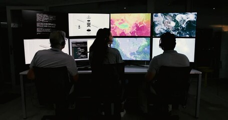 Fototapete - People, control room and team monitor satellite maps to track storm weather pattern with back. Meteorologist, climate scientist or group on screen with ai code for global warming at night on overtime