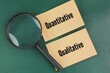 © Fauzi - magnifying glass and paper with the words quantitative and qualitative