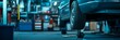 © Elmira - A car is elevated on a hydraulic jack for servicing in a comprehensive auto shop. The surroundings feature tools and equipment typical of an automotive repair environment