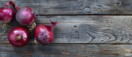 Poster - red onions on weathered wood. Copy space image. Place for adding text and design