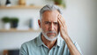 © Niks Ads - middle aged man suffering from head pain