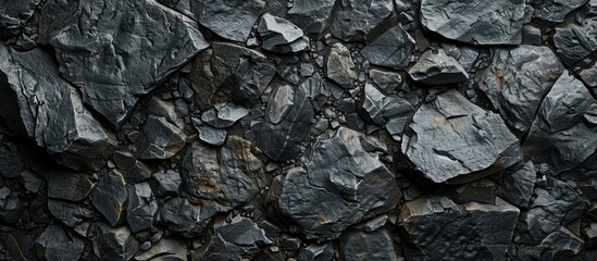 Poster - Dark gray stone backdrop with copyspace Black grunge banner featuring rock texture The surface of the stone wall