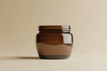 Wall Mural - A Clear Glass Jar with a Brown Tinge on a Beige Background