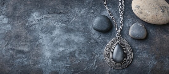 Aufkleber - Bohemian style silver jewelry set and pebble against a vintage grey background Top view. with copy space image. Place for adding text or design