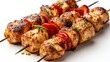 © nitiroj - a chicken kebab with peppers, street food, grilled to perfection, isolated on white background