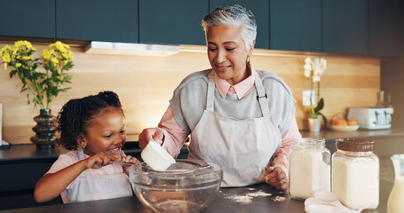 Canvas Print - Baking, child and helping grandmother with preparation for cookies, dessert and childhood development. Flour, baker woman and girl bonding in kitchen with teaching cake recipe, support and education