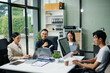 © laddawan - Group of Asian business meeting in planning design in creative business discussing work