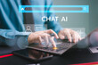 © FON's Fasai - Ai chat bot with customer help modern business. Businessman use computer open chat Ai application, Artificial intelligence robot. Mobile app convenient assistance. Conversation prompt generate service