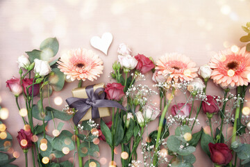 Wall Mural - Beautiful bouquet of flowers with gift box and heart and bokeh lights - top view - greeting card for birthday, mother's day, wedding	