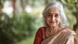 © Plaifah - A serene portrait of an elderly woman with silver hair, wearing traditional attire, showcasing her elegant and timeless beauty