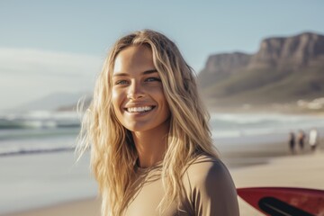 Portrait of a young Caucasian female surfer on the beach