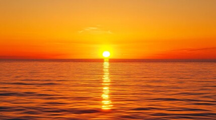Leinwandbilder - A vibrant orange sunset over a calm sea, with the sun dipping below the horizon and casting a warm glow across the water