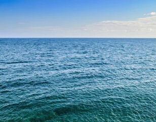 Wall Mural - Background image of a summer's day with a lovely, blue sea surface