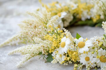 Wall Mural - Beautiful wreath of white daisies and yellow flowers lying on a textured stone surface