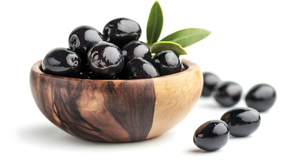 Black Olives in a Wooden Bowl with Sprig of Green